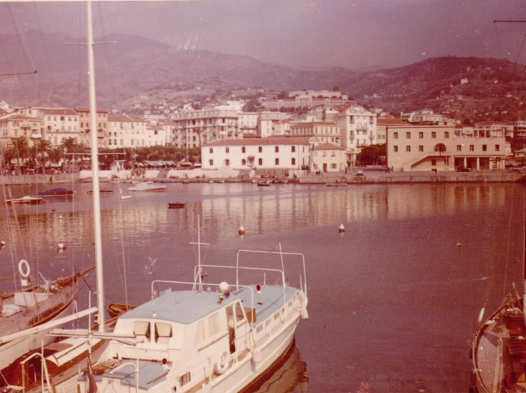 a white boat sitting on top of a body of water