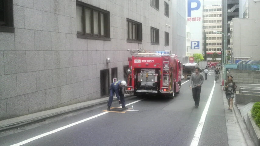 a fire engine parked in a street near a building