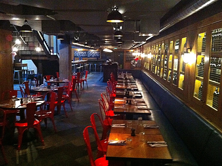 a room with many red chairs in it