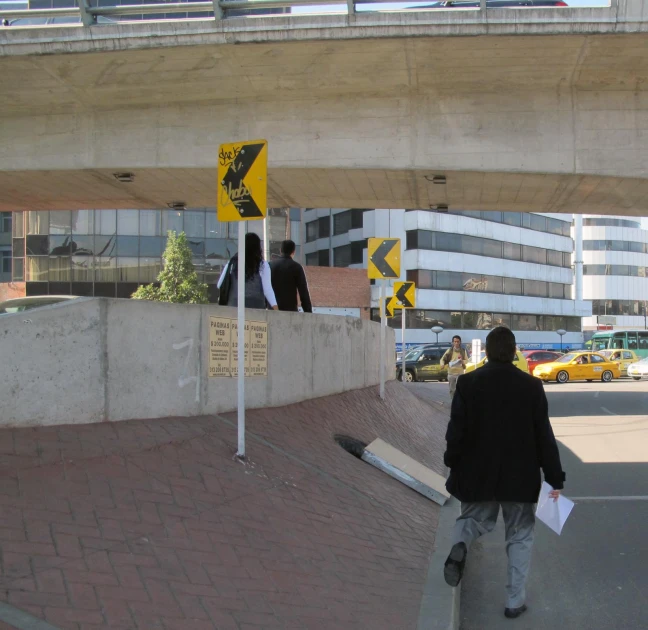 a person is walking under an overpass