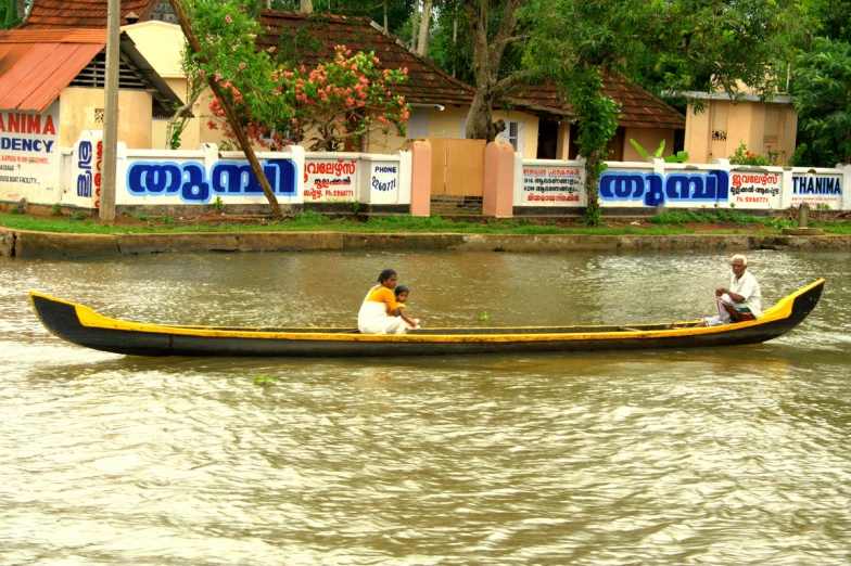 two people in a canoe are floating down a river