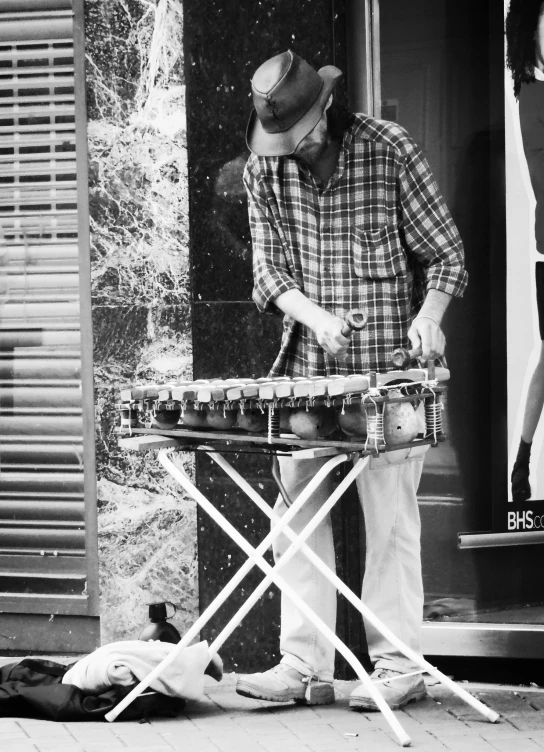 a man with some kind of musical instrument in front of him