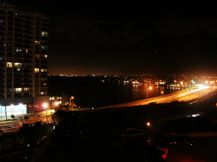 a busy city street that has cars going down it