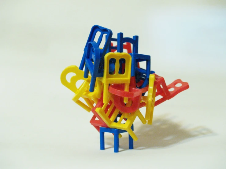 a group of colorful plastic objects are on a white surface