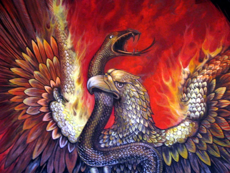 an eagle with flames and fire surrounding its wings