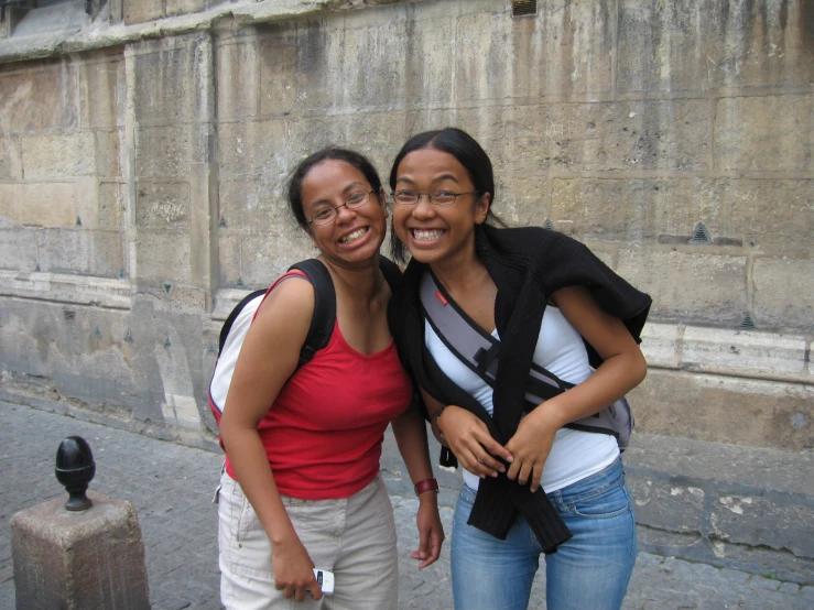 two women that are standing near each other