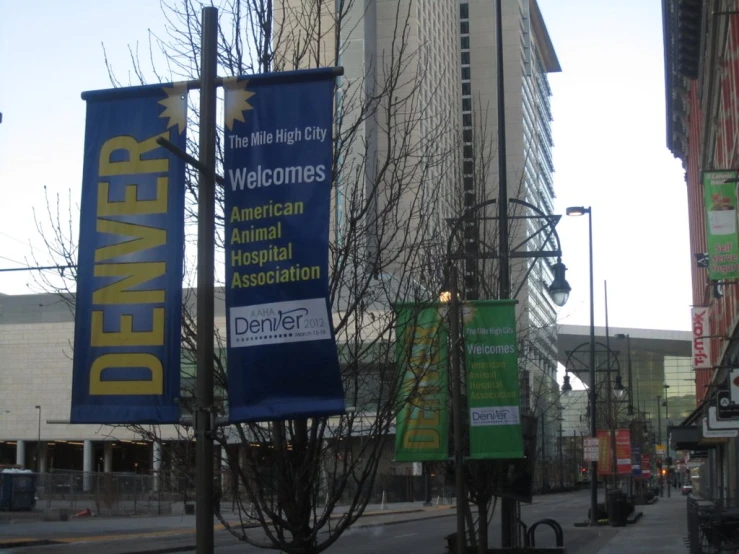 large political banner attached to buildings near city