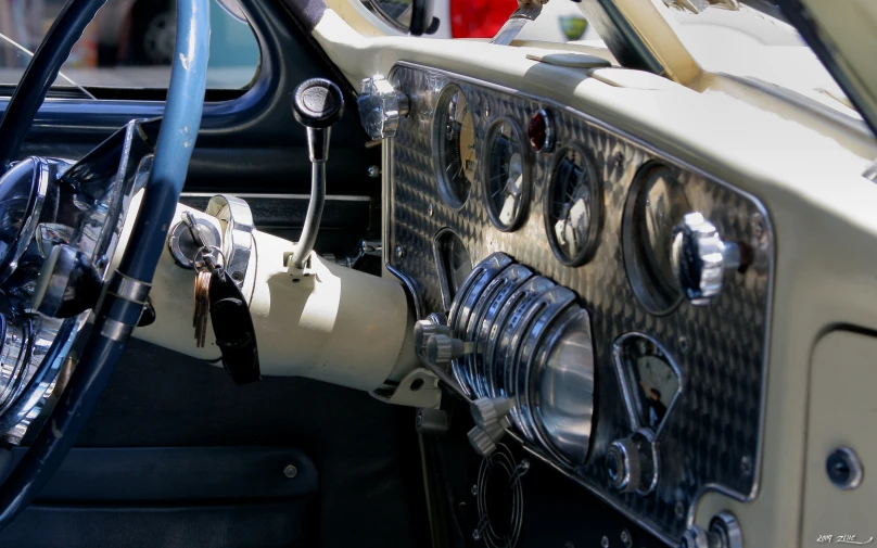 a view of the dashboard of an old fashioned car