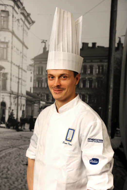 a man in a chef outfit standing by a street