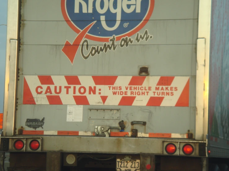 the back end of an old kroger truck with caution tape