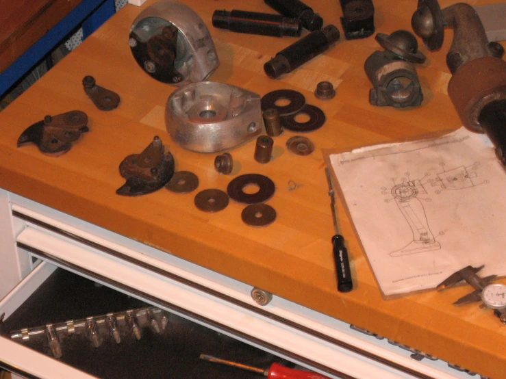a cluttered kitchen counter with many types of tools