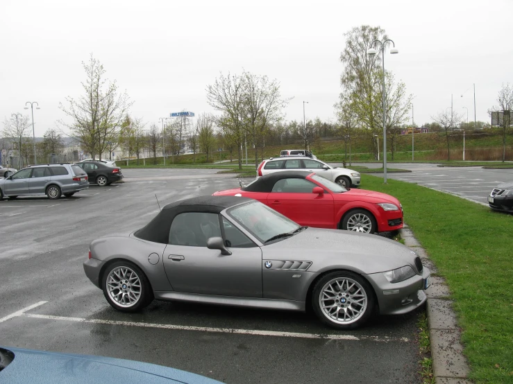 cars parked on the side of the road near another