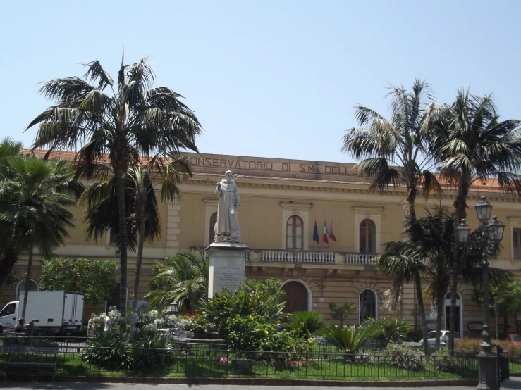 an elaborately decorated building stands near palm trees