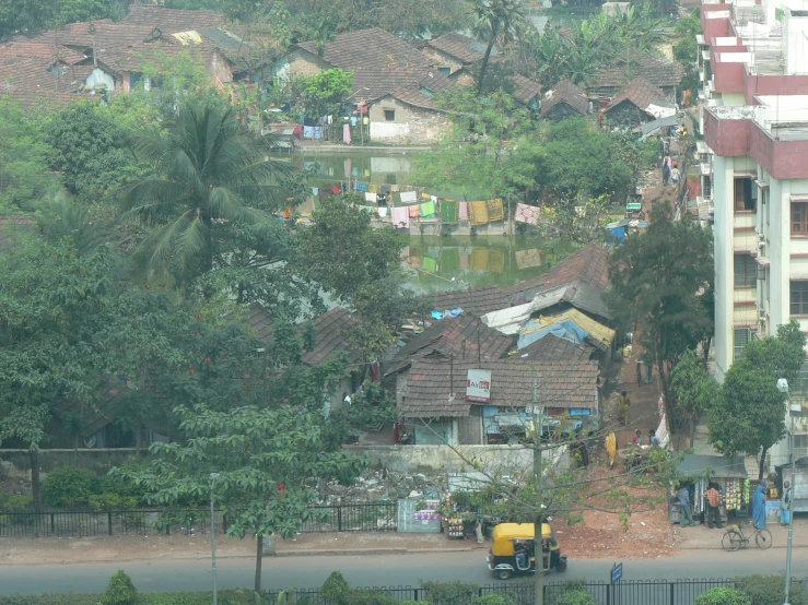 people standing outside in front of a city with some buildings