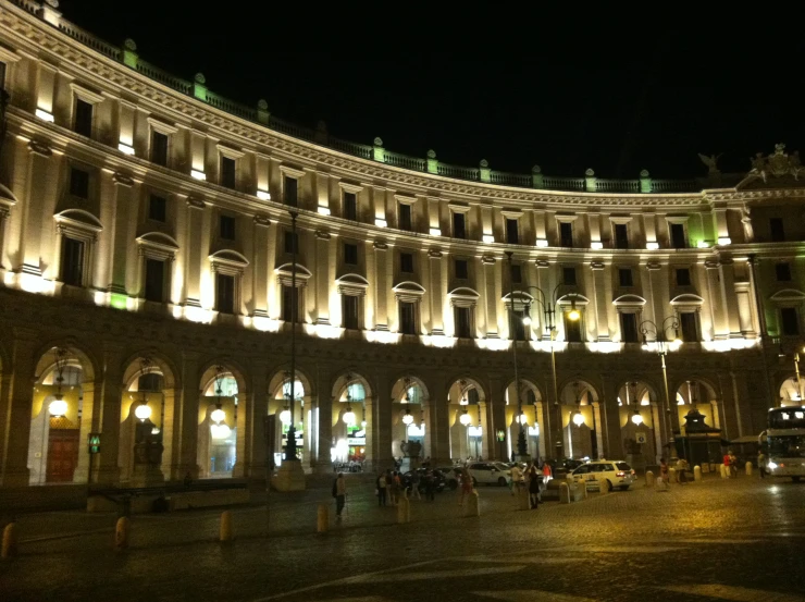 the building has many windows at night and lit up