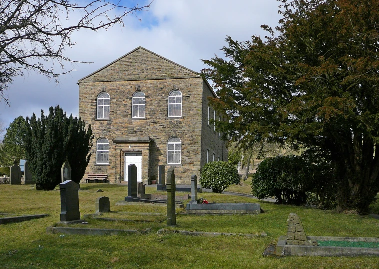 the house is made of two stone buildings