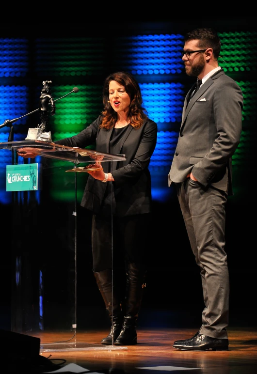 a man and a woman at a podium