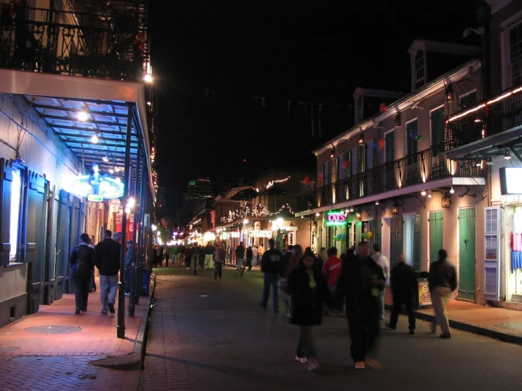 the people are walking along the street together