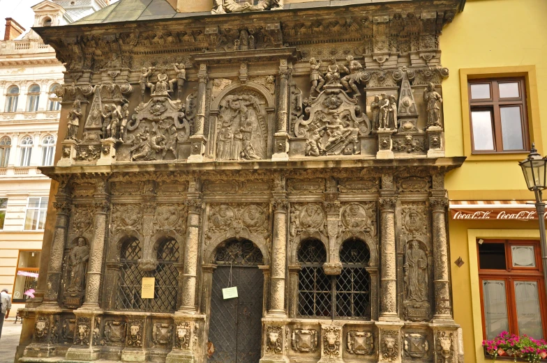 a old stone building in the middle of a town