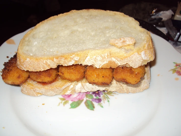 a very fancy looking sandwich on top of a white plate