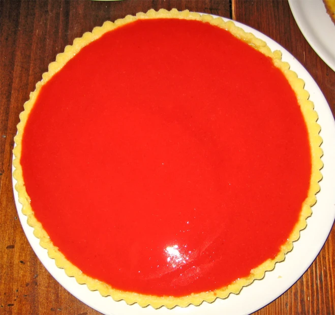 an orange and yellow dessert sits on a plate