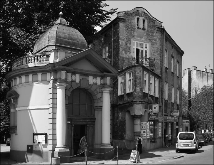 a black and white po of a building with an ornate tower