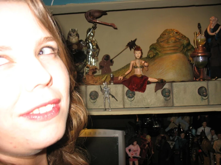 a woman posing for a picture in front of an elaborate display