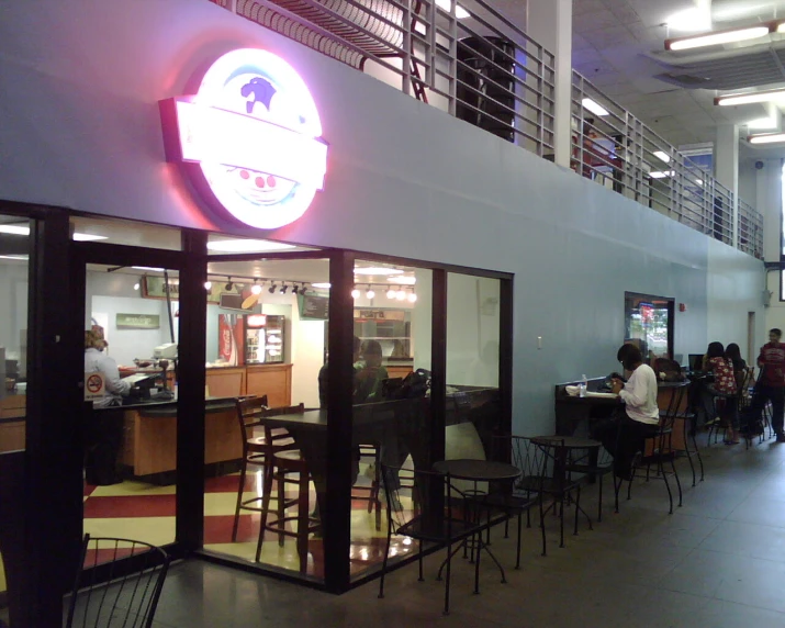 a restaurant with customers dining at its counter