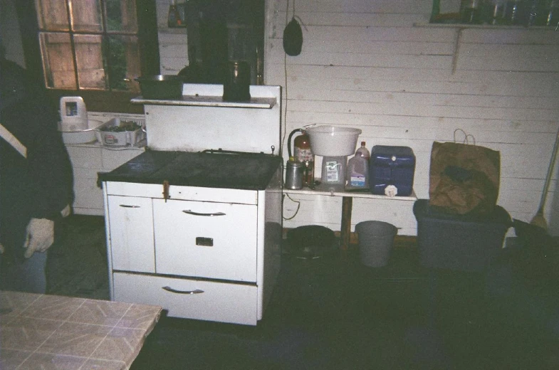 an old fashioned stove in an old looking kitchen