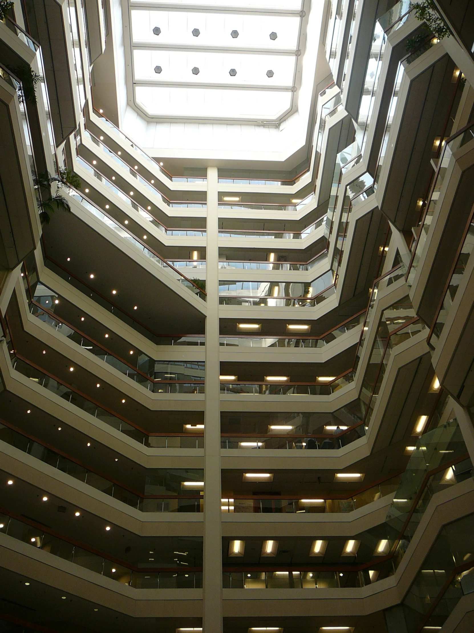 an atrium with skylights on either side of it