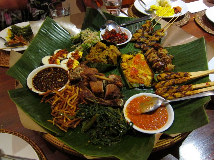 a variety of food is arranged on top of a table