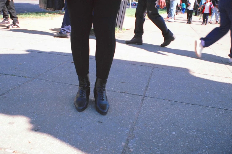 a person wearing a black skirt and blue jacket
