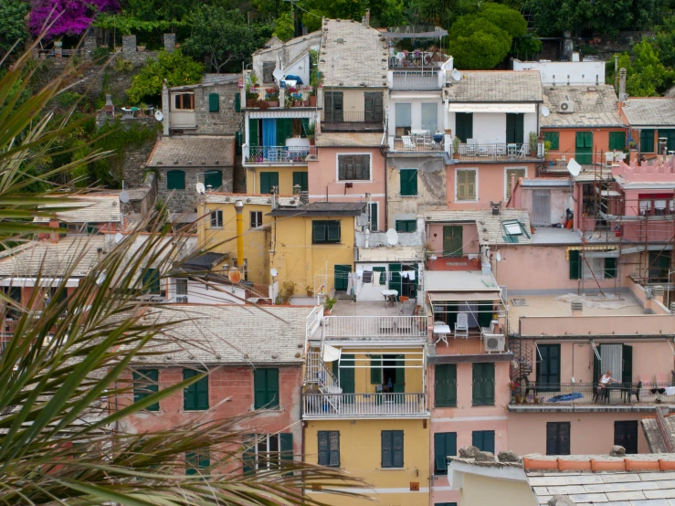 the houses are stacked high on the mountain top