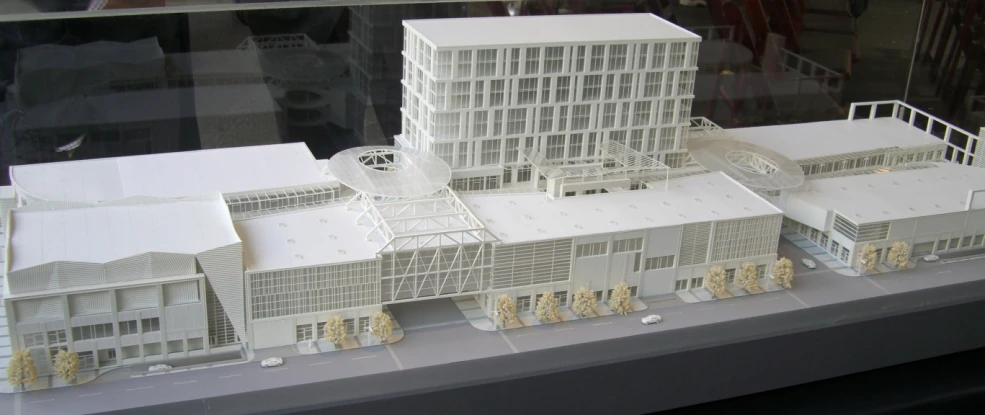 a model of a white building is on display