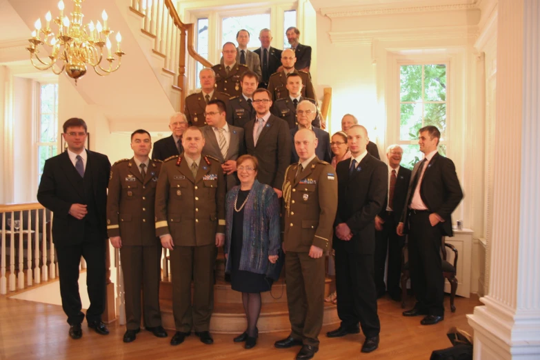 several military men and women in suits posing for a group po
