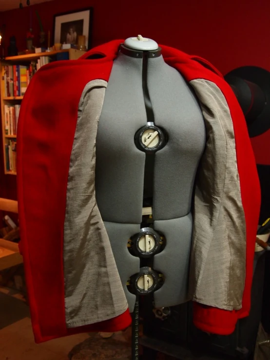 a red jacket on display in a room