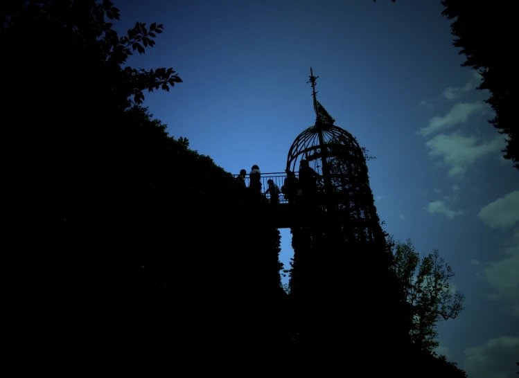 a building with a clock tower surrounded by trees