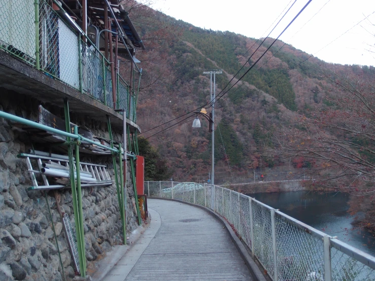 a stone house that is next to a river