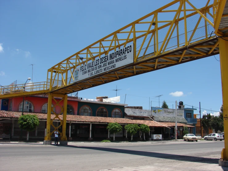 an overhead crane over a commercial building with no roof