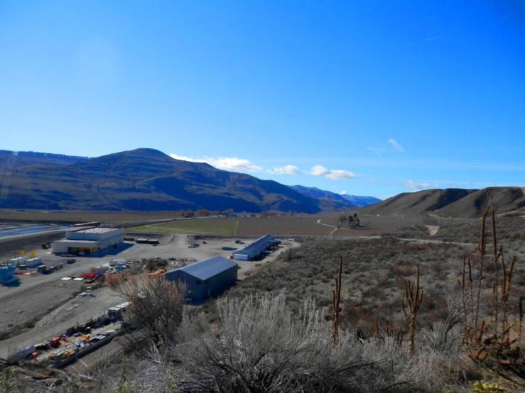 a dry desert landscape with mountains in the background