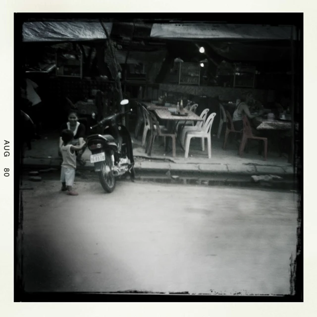 black and white pograph of a restaurant with the door open