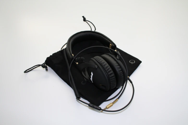 a couple of headphones sit on top of a bag