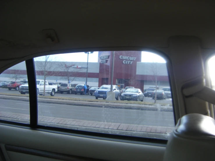 the view from inside of a car of a city gas station