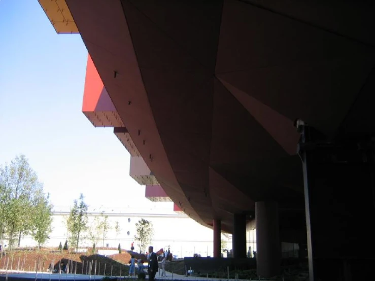 people in line under a covered walkway