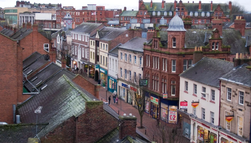 there are buildings along side the street in this town