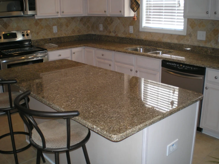 the kitchen countertops are brown in color