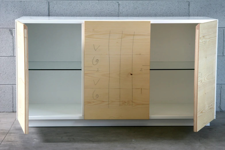 an unfinished cabinet that is white and is not made from plywood