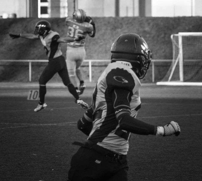 two football players playing in the field during a game