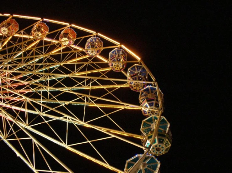 an amut wheel lit up at night during a show