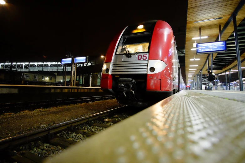 a train sitting on the tracks at night